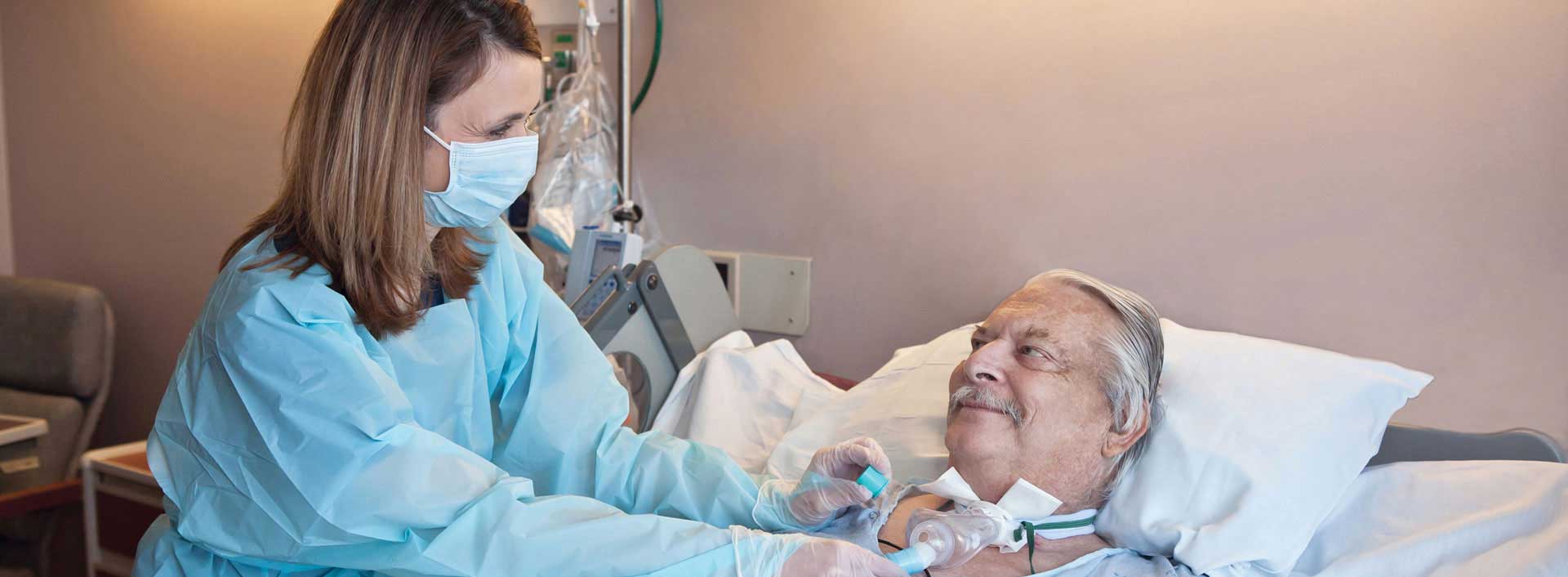 Clinician placing the PMV007 on a ventilated patient Clinician placing the PMV007 on a ventilated patient